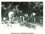 Using different camp cooking devices at Marjory Camp, The University of Iowa, Jul. 22, 1931