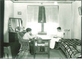 Students studying in a Currier Hall dorm room, The University of Iowa, 1916