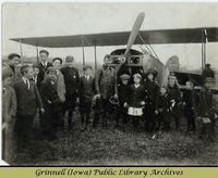 Billy Robinson with Canadian school children and biplane