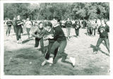 Kappa Kappa Gamma members playing football, The University of Iowa, 1960s