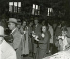 Alumni pose for a photo while enjoying refreshments at the Homecoming Alumni Luncheon, 1954