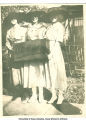 Women in hats with suitcase and pennant, Iowa, 1910s