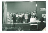 First graders singing on stage, The University of Iowa elementary school, March 1958